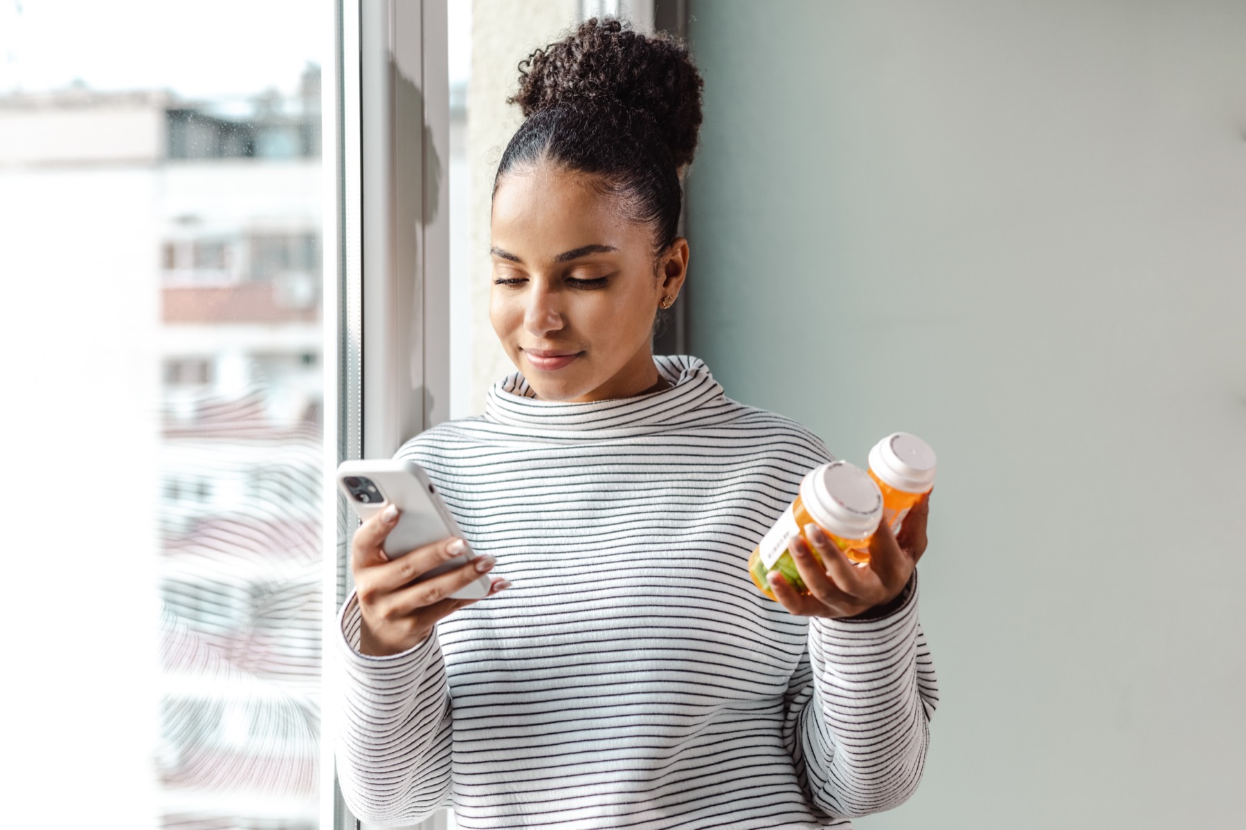 Person checking medications on phone